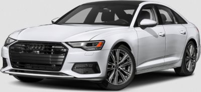 Front view of sedan with large aggressive black grille and sleek LED headlights