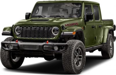 Front view of rugged pickup with distinctive grille and off-road tires