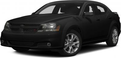 Front-side view of black sedan with sleek headlights and alloy wheels