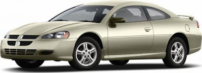 Sleek front side view of a two-door coupe with distinctive headlights and alloy wheels.