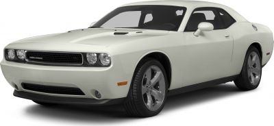 White two-door coupe with dual headlights and chrome alloy wheels