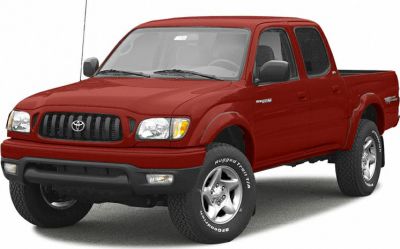 Red double cab pickup with rugged tires and distinctive front grille