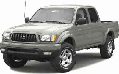 Double cab pickup truck with rugged off-road tires and robust front grille