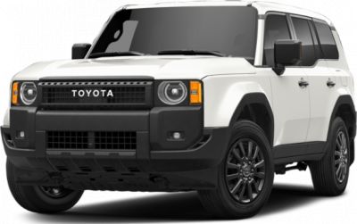 Bold front grille and round headlights of a white SUV