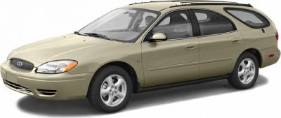 Beige midsize station wagon four-door side view.