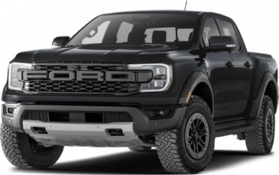 Front view of a black pickup with aggressive grille and off-road tires