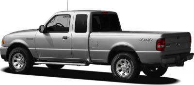 Side profile of a silver extended cab pickup truck with 4x4 badge