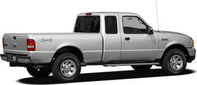 Silver pickup with extended double cab, 4x4 badge, chrome wheels, and side steps
