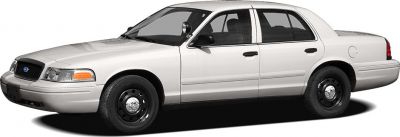 Side view of a classic full-size sedan with black steel wheels and four doors