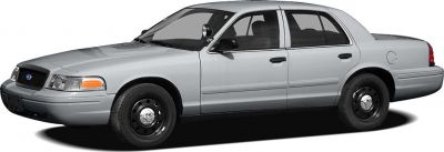 Silver four-door sedan with steel wheels and spotlight mirror