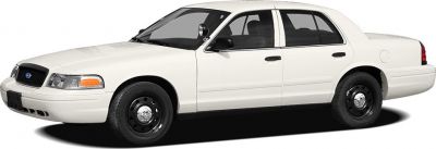 White four-door sedan with spotlight and black steel wheels