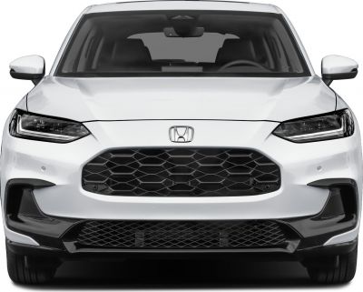 Front view with LED headlights and large honeycomb grille