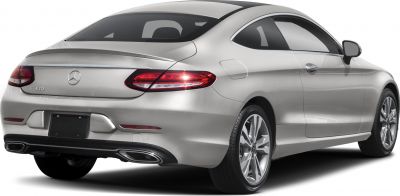 Rear side view of a sleek coupe with LED tail lights and dual exhaust outlets