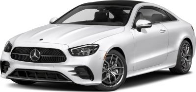 Front angled view of luxury white coupe with LED headlights and AMG wheels