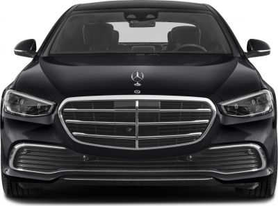 Luxury sedan front view with chrome grille and LED headlights