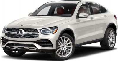 Front 3/4 view of a white luxury coupe SUV with distinctive grille and alloy wheels