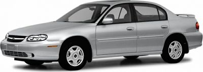 Silver sedan with rounded headlights and smooth aerodynamic body.