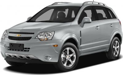 Front grille with Chevrolet badge and 5-spoke alloy wheels on silver SUV