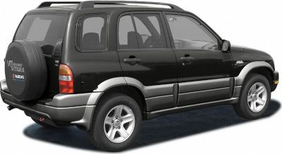 Rear side profile with mounted spare tire and silver lower body trim