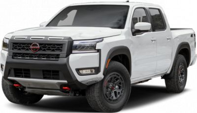 Front view of white crew cab pickup with distinctive grille and rugged wheels