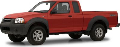 Red extended cab pickup with black fender flares and rugged styling