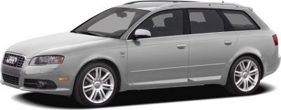 Silver station wagon side view with sporty alloy wheels and roof rails