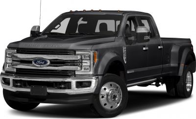 Heavy-duty truck with dual rear wheels, crew cab, and long cargo bed