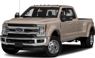 Heavy-duty crew cab pickup with dual rear wheels and long bed.