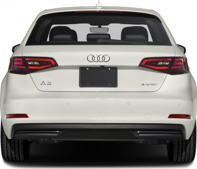 Rear hatchback view with distinctive LED taillights and badges