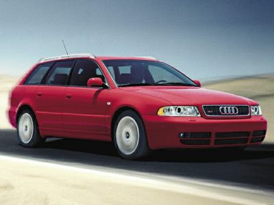 Red sporty station wagon with characteristic headlights and sleek body lines