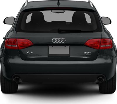 Rear view of station wagon with taillights, dual exhaust, and roof rails