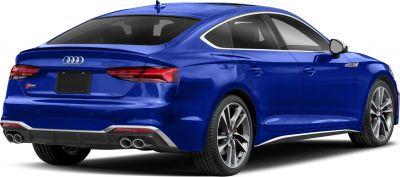 Rear and side view of a sporty blue sedan with quad exhaust and sleek taillight design