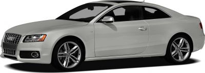 Side profile of a silver coupe with V8 badge and alloy wheels