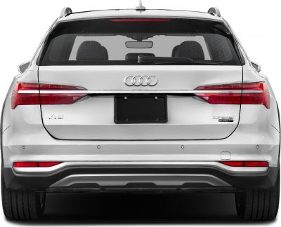 Rear view of white Audi A6 Avant Allroad with distinctive taillights and badging.
