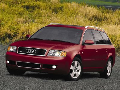 Red station wagon front view with roof rails and fog lights