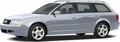 Side profile of a silver station wagon with alloy wheels and roof rails