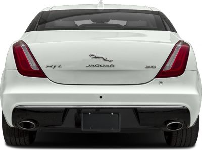 Sleek rear design with prominent tail lights and dual exhausts