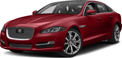 Front view of red luxury sedan with chrome grille and alloy wheels
