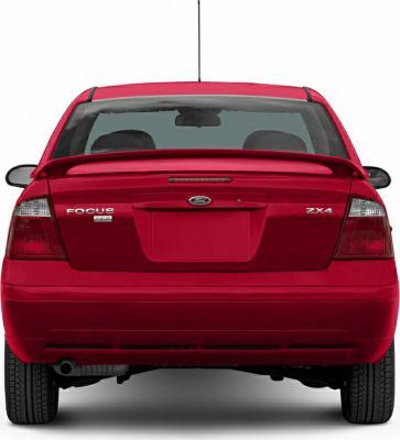 Rear view of red hatchback with spoiler and taillights