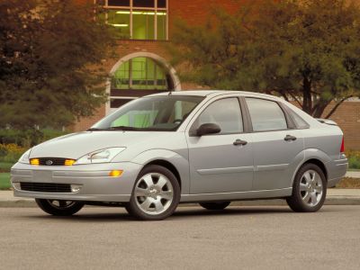 Four-door sedan with illuminated front turn signals and alloy wheels.