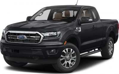 Front side view of a pickup truck with prominent grille and alloy wheels