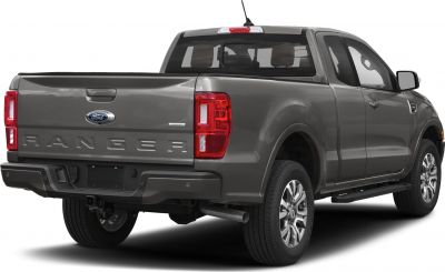 Extended cab mid-size pickup rear with prominent tail lights and alloy wheels