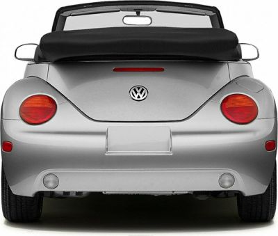 Rear of a convertible car with round taillights and folded soft top