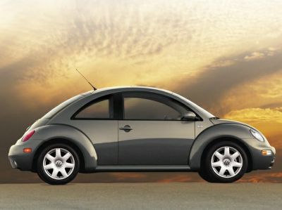 Side profile of compact car with rounded design and curved roof silhouette