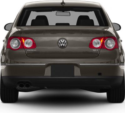 Rear view with taillights, dual exhausts, and emblem badge