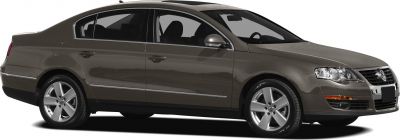 Side profile of a sedan with alloy wheels and four doors