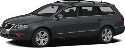 Side profile of a station wagon with roof rails and alloy wheels.
