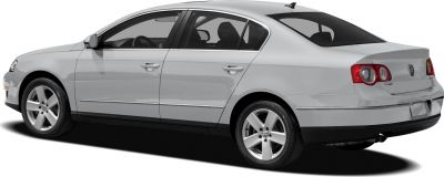 Rear three-quarter view of a silver sedan with distinctive taillights and alloy wheels