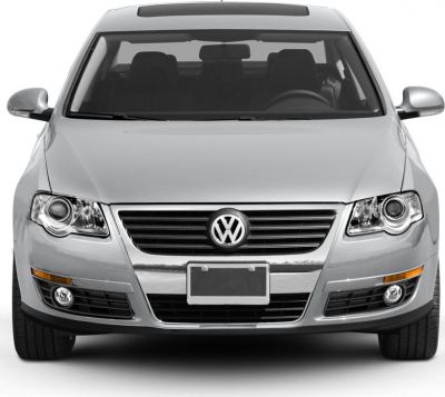 Front view with grille, headlights, and fog lights of a silver vehicle