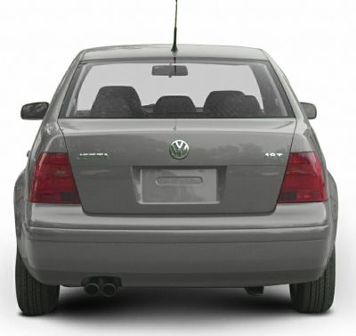 Rear view with tail lights, 1.8T badge, and dual exhaust pipes